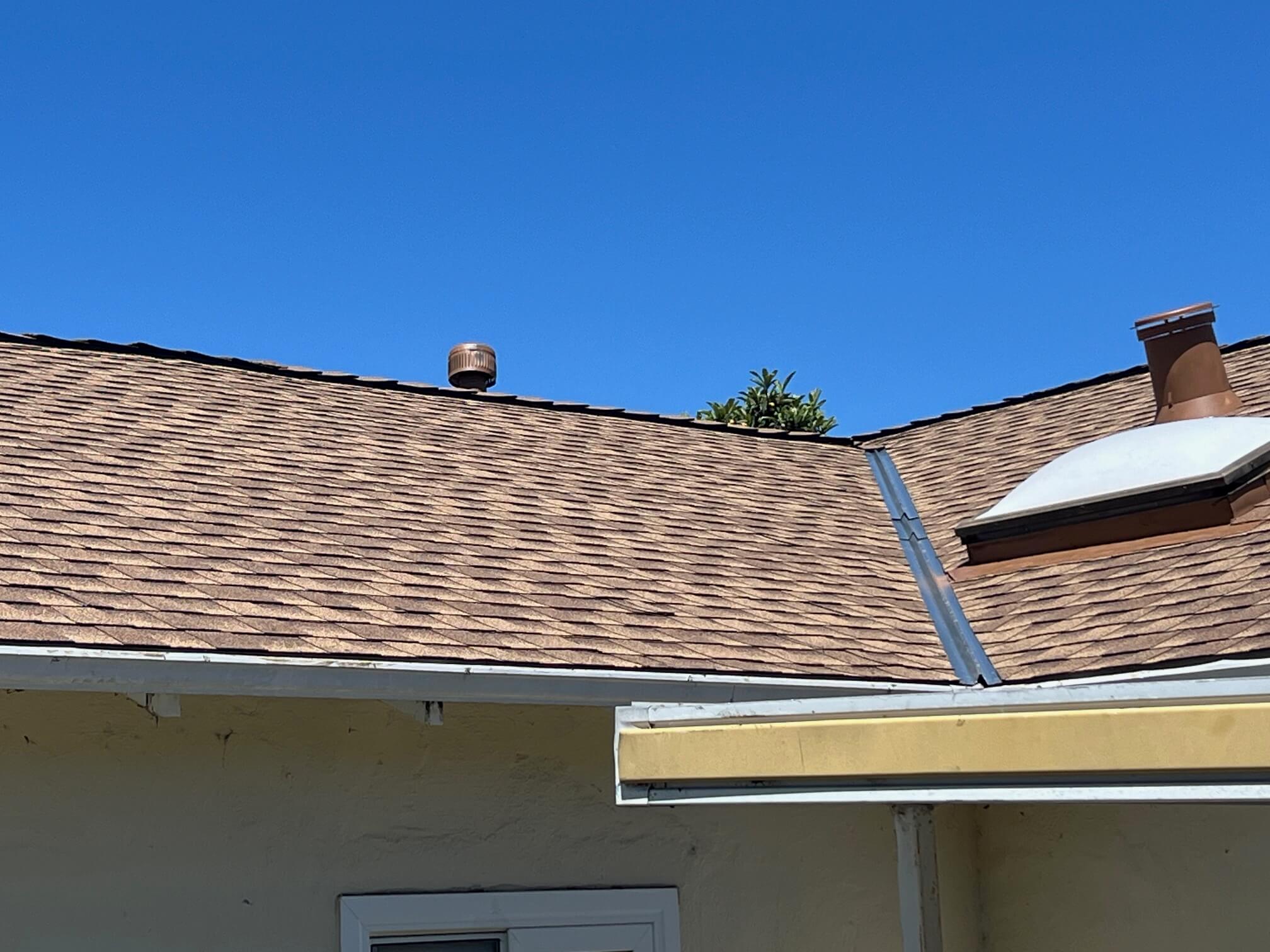 Finished Roof Installation – Solar Ready – Sunnyvale, CA New composition roof in Sunnyvale, CA, with skylight flashing, ridge vent, and open valleys, installed by Home Pro Roofing and Solar and prepped for QCells solar panels.